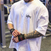 Camiseta Alpha Performance – Edición Iron Strength y Oversize gimnasio